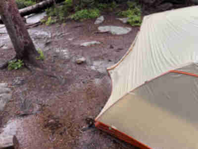 Inch deep puddles of water around (and underneath) our tent