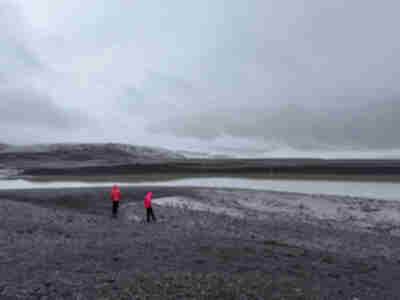 I love this photo as it shows how monochromatic the landscape is with the fog - and how bright the girls' coats are