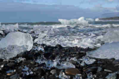 Icebergs from Jökulsárlón pushed back up onto the black sand beach at Diamond Beach