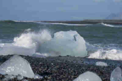 Icebergs from Jökulsárlón pushed back up onto the black sand beach at Diamond Beach