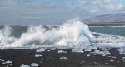 Icebergs from Jökulsárlón pushed back up onto the black sand beach at Diamond Beach