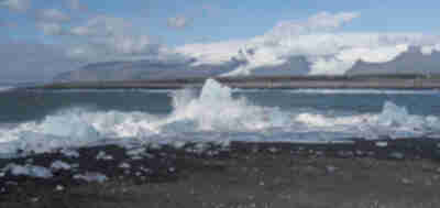 Icebergs from Jökulsárlón pushed back up onto the black sand beach at Diamond Beach