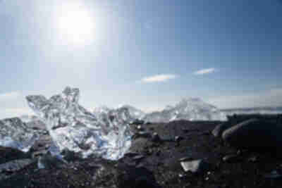 Icebergs from Jökulsárlón pushed back up onto the black sand beach at Diamond Beach