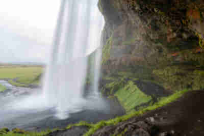 Hiking behind the Seljalandsfoss waterfall