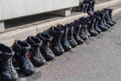 Rental boots lined up outside one of the outfitter shops to dry in the morning sun