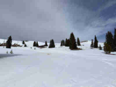 Thin snow coverage above the hut