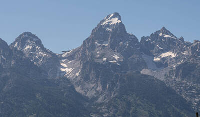 A plane in front of the Tetons