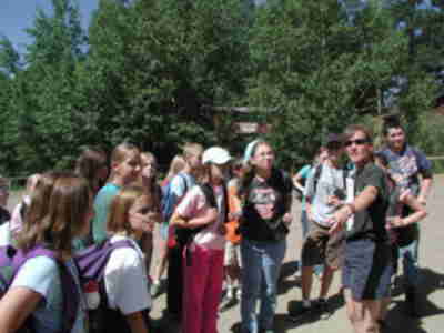 Receiving instructions from Ms. Vickery about collecting our luggage.