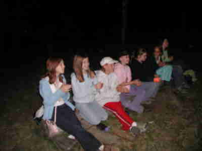 Singing "Green Grass" around the campfire