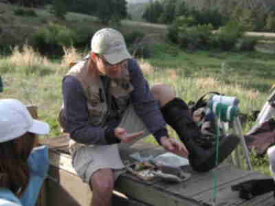 Aaron preparing the poles with flies