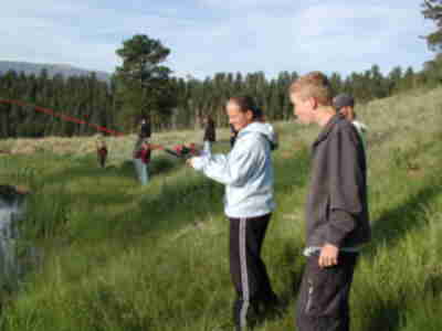 Greg providing Lauren with some fishing tips