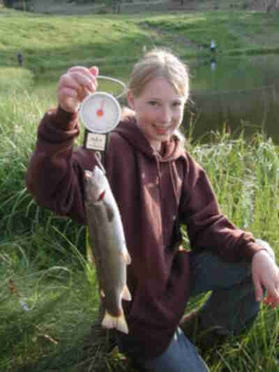 Erin with the fish she caught prior to releasing it in the water