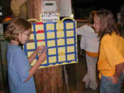 Danielle playing Wildlife Jeopardy with a visitor from Earth Science