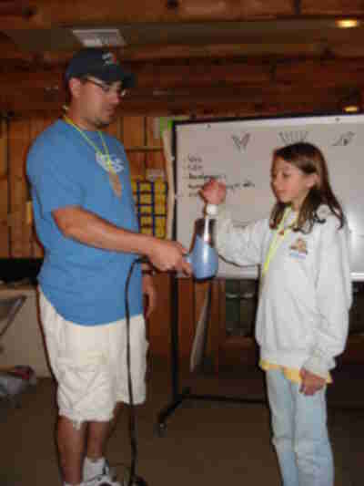 Sarah helping with a demonstration of Bernoulli's Principle