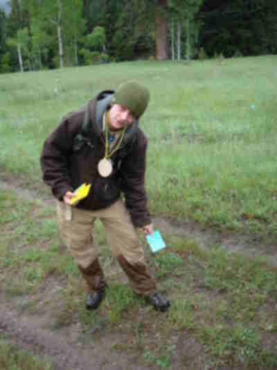 Andrew distributing food and water cards throughout the meadow