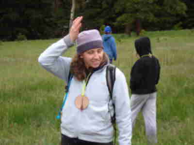 Lisa demonstrating how a mule deer uses its ears to detect predators