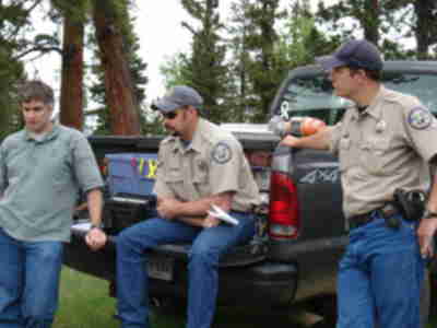 Aaron Lindstrom, Nick Gallowich and Todd Schmidt from the Colorado Division of Wildlife