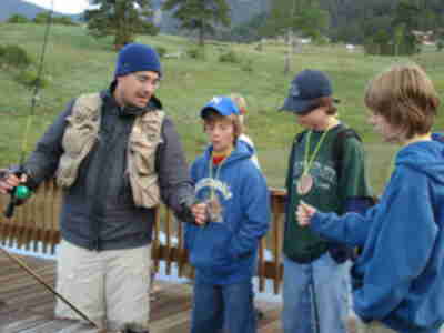 Aaron showing the different types of flies strung to the poles