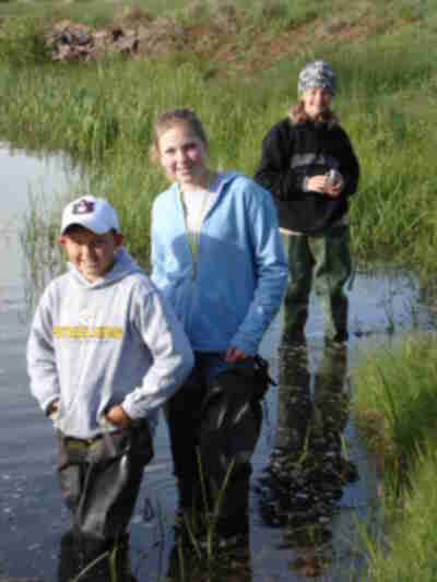 Dakot, Amber and Madelyn with waders on