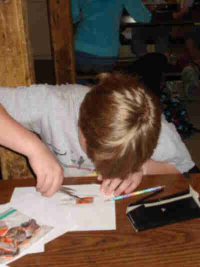 Brett collecting scales from a piece of Sockeye Salmon