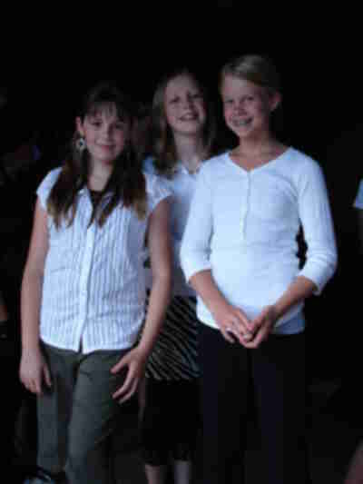 Nehemiah, Ali and Madelyn waiting to be seated