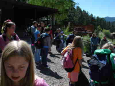 Students picking up their luggage