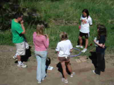 A group discusses how to determine how many mountain lions live in the Evergreen area