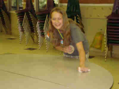 Steph cleans the table during hopper duty