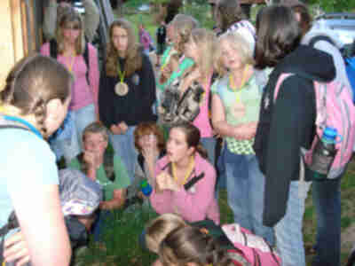 The group looking at a dead bat found in front of the barn earlier in the day