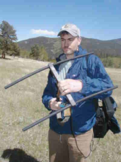 Aaron Linstrom with the Colorado Division of Wildlife demonstrating how Radio Telemetry works