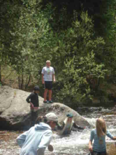 Laura taking a bad step and falling into the creek.