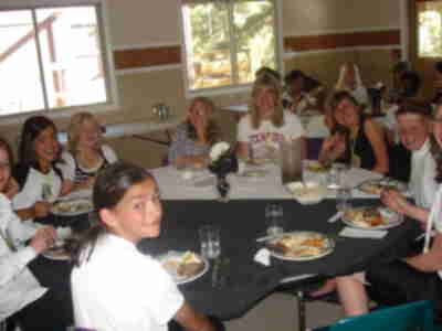 The "international crowd" enjoying dinner at Chez Evans, a "highly rated restaurant by Zagat"